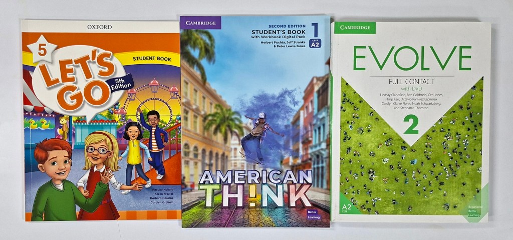 ELT coursebooks designed for different age groups, showing Let’s Go for primary learners, American Think for teenagers, and Evolve for young adults.