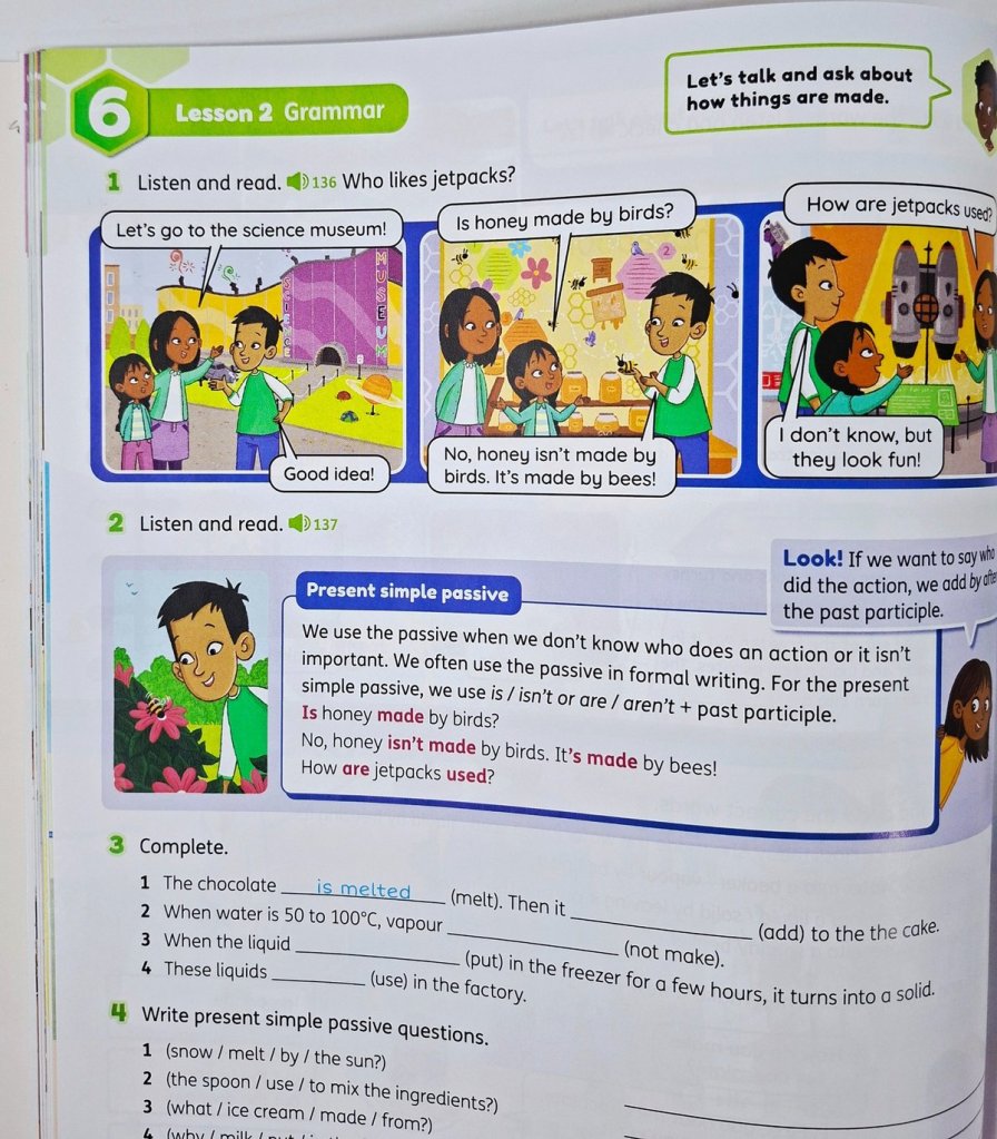 Beehive Student Book Level 6 grammar lesson showing present simple passive with classroom examples