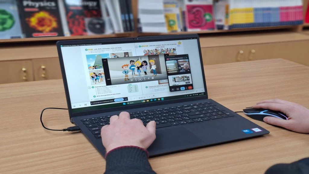 Teacher demonstrating an online English lesson with the Cambridge One app at Nour E-Sham Book Centre