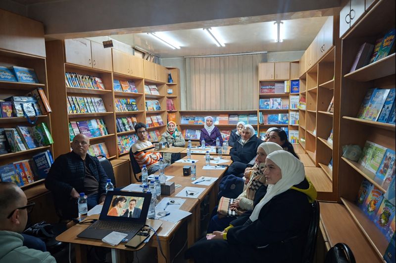 “Group of ELT teachers during the January 2026 Teachers’ Space session at Nouresham Book Centre, seated around a table in the bookshop.”
