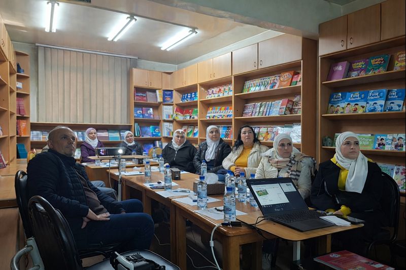 “ELT teachers attending the January 2026 Teachers’ Space session at Nouresham Book Centre, engaged in a group discussion surrounded by English learning materials.”
